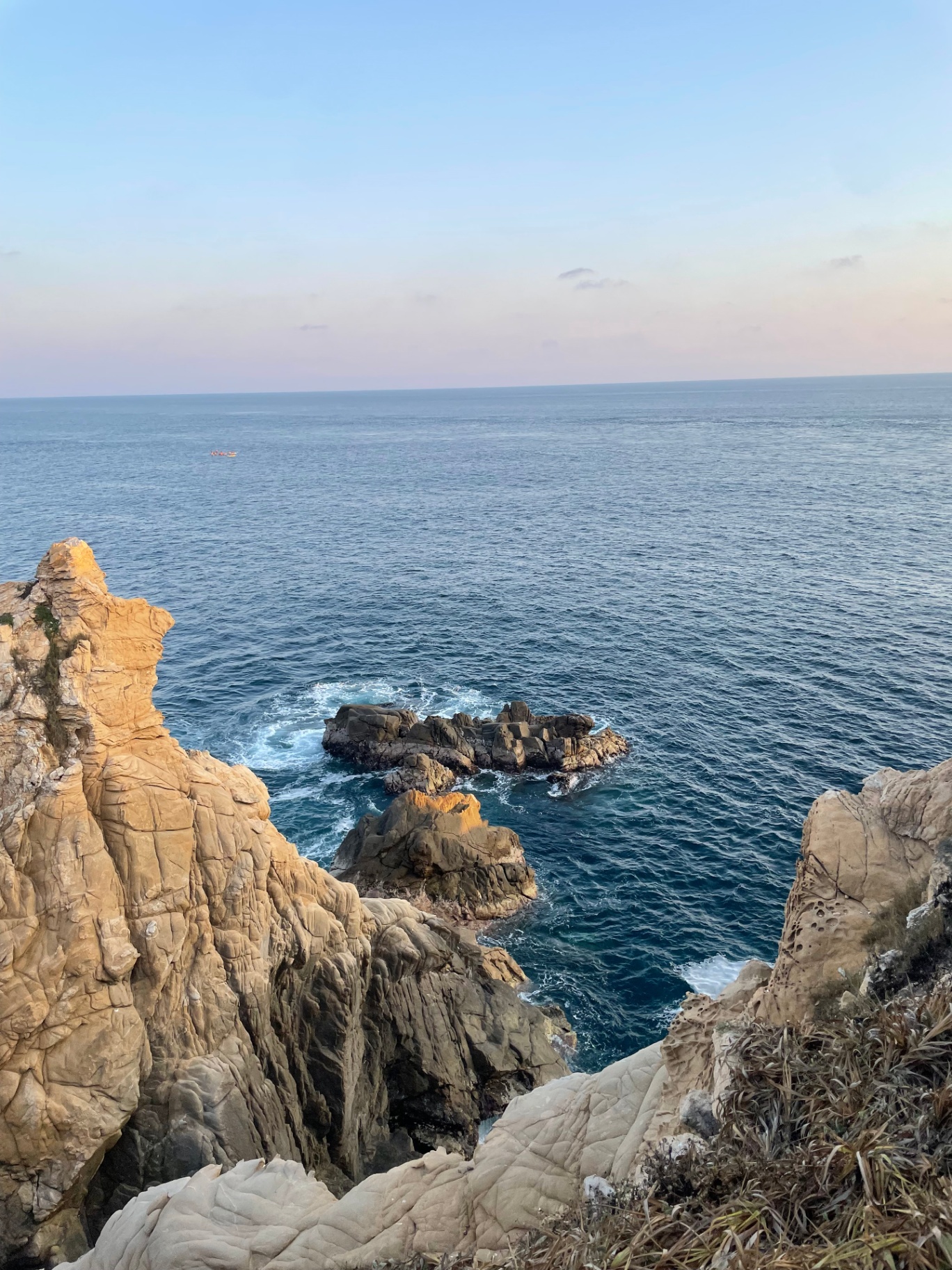 Dramatic cliffs and rock formations meeting the ocean